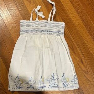 White Dress with Blue and Yellow Sailboat Design